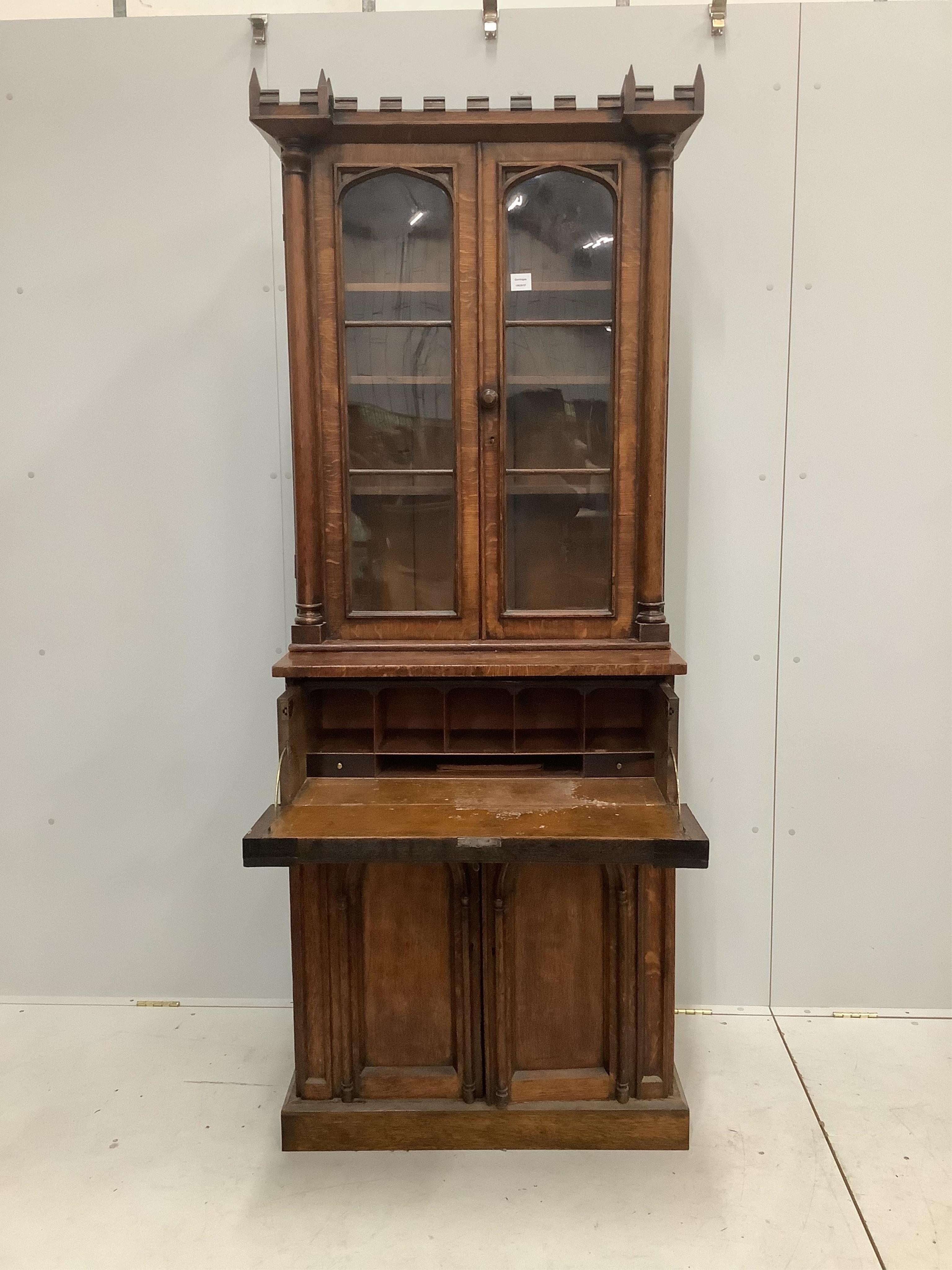 A William IV Gothic Revival oak secretaire bookcase, width 85cm, depth 47cm, height 209cm. Condition - poor to fair